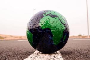 Globe on the road photo