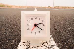 Clock on the road photo