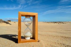 Hourglass on the beach photo