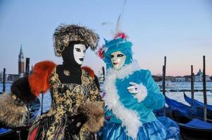 Unidentified people wearing carnival masks at the Venice Carnival in Venice, Italy, circa February 2022 photo