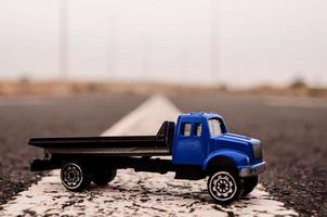 Toy truck on the road photo