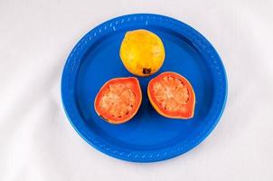 Guavas on a blue plate photo
