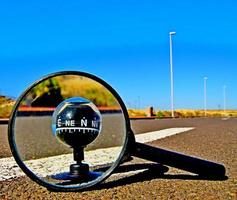 Magnifying glass on the road photo