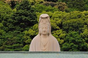 Buddha torso statue outdoors photo