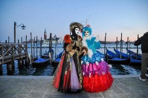 Unidentified people wearing carnival masks at the Venice Carnival in Venice, Italy, circa February 2022 photo