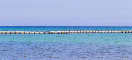 Blue water waves and ocean with buoy and ropes Mexico. photo