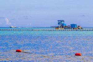 Boats yachts ship jetty beach in Playa del Carmen Mexico. photo