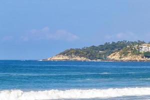 Extremely huge big surfer waves at beach Puerto Escondido Mexico. photo