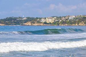 Extremely huge big surfer waves at beach Puerto Escondido Mexico. photo