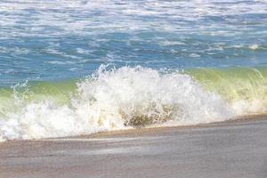 Extremely huge big surfer waves at beach Puerto Escondido Mexico. photo