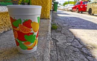 Green healthy juice smoothie in to go cup in Mexico. photo