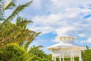 White noble pergula pavilion in paradise on beach palms Mexico. photo