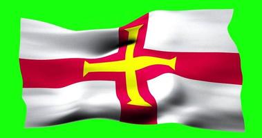 Flag of Guernsey realistic waving on green screen. Seamless loop animation with high quality video