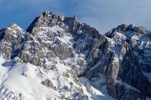 Amazing view of different mountain peaks with snow during winter in Triglav National Park. Beautiful mountain range and amazing attraction for alpine climbers. Adventurous lifestyle. photo