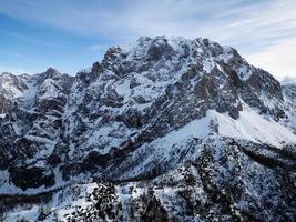 Amazing view of different mountain peaks with snow during winter in Triglav National Park. Beautiful mountain range and amazing attraction for alpine climbers. Adventurous lifestyle. photo