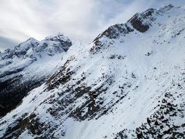 Amazing view of different mountain peaks with snow during winter in Triglav National Park. Beautiful mountain range and amazing attraction for alpine climbers. Adventurous lifestyle. photo