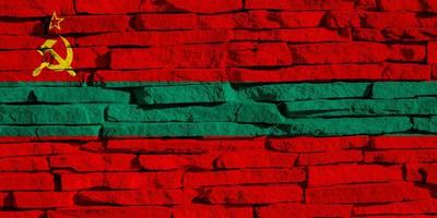 Flag of Pridnestrovian Moldavian Republic on a textured background. Concept collage. photo