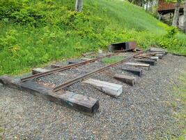 section of old obsolete train track rails photo