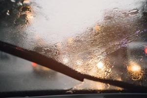 Drizzle on the windshield in the evening. photo