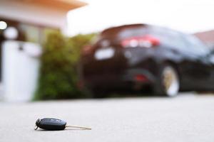 abstract lost car keys fall lying on the street concrete cement ground roadway office front yard. transportation concept. Leave copy space to write messages text. photo