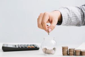 close up hand business man accounting calculator photo