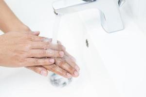 Cleaning Hands. Washing hands with soap under the faucet with water Pay dirt photo