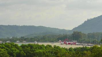 PHUKET, THAILAND NOVEMBER 26, 2019 - Timelapse of Phuket International Airport, view from upper floor Splash beach resort hotel video