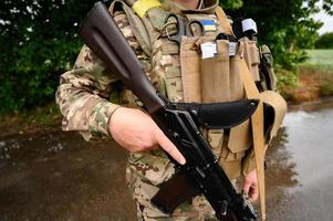 Military clothing and military bulletproof vest with parts and ammunition, Ukrainian military and war. photo