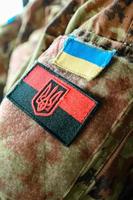Chevrons on the Ukrainian military pixel uniform. photo