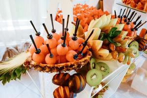 Exquisite festive table with sweets and fruits. photo