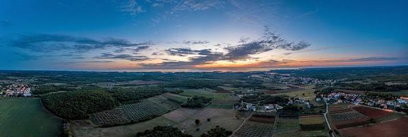 Drone panorama over Istrian Adriatic coast near Porec taken from high altitude at sunset photo