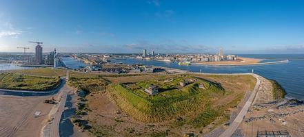 Drone panorama over the harbor and skyline of the Belgian city of Oostende photo