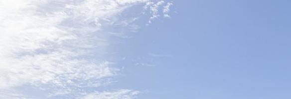 Image of a partly cloudy and partly clear sky during the day photo