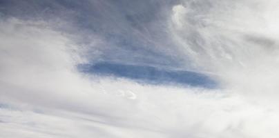 Image of a partly cloudy and partly clear sky during the day photo