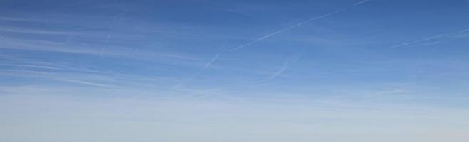 Image of a partly cloudy and partly clear sky during the day photo