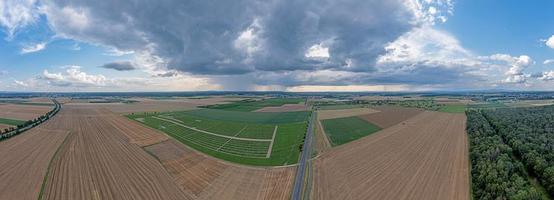 Drone panorama of a thunderstorm with rain and dramatic cloud formations over Leeheim in the Hessian Ried region photo