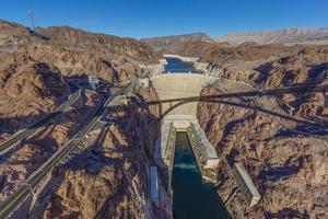 View from Mike O Callaghan Pat Tillman Memorial Bridge to the Hoover Dam in the evening photo