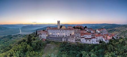 Drone panorama on historical Croatian town Motovun in Istria in the morning during sunrise photo