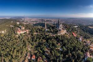 Drone panorama over Catalan metropolis Barcelona taken from Tibidabo direction during the day photo