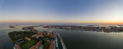 Aerial panorama of the lagoon of Venice and Lido island during sunrise photo