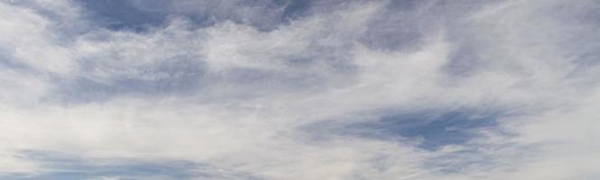 Image of a partly cloudy and partly clear sky during the day photo