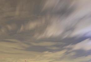 Dramatic colorful sky with afterglow and illuminated clouds photo