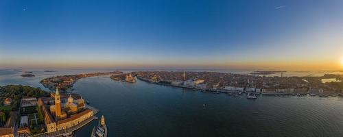 Aerial panorama of the lagoon of Venice and Lido island during sunrise photo