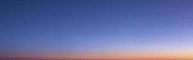 Dramatic colorful sky with afterglow and illuminated clouds photo