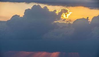 Dramatic colorful sky with afterglow and illuminated clouds photo