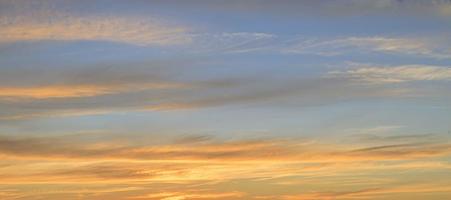 Dramatic colorful sky with afterglow and illuminated clouds photo