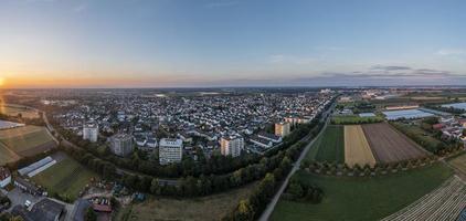 Drone panorama over German municipality Weiterstadt in southern Hesse during sunset photo