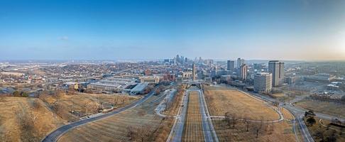 Drone panorama of World War II memorial with Kansas City skyline during sunrise photo