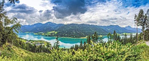 Panoramic view over turquoise lake Weissensee in Austrian province Carinthia during daytime photo