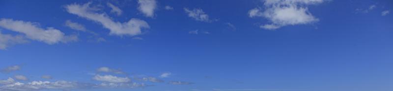 Image of a partly cloudy and partly clear sky during the day photo